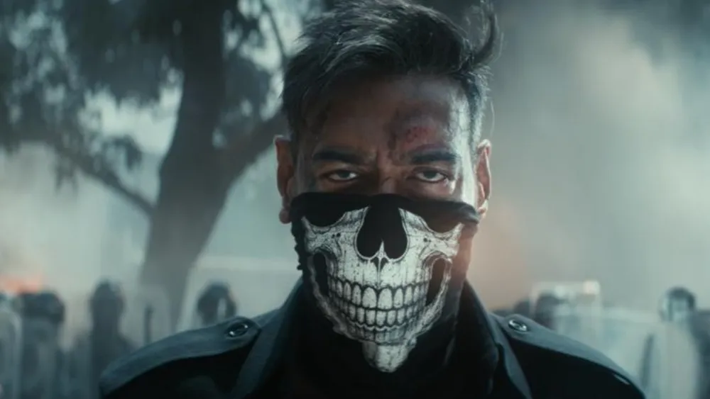 Man in a dark jacket wearing a skull-pattern face covering