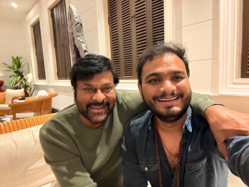 Actor Chiranjeevi and filmmaker Srikanth Odela pose together for a selfie